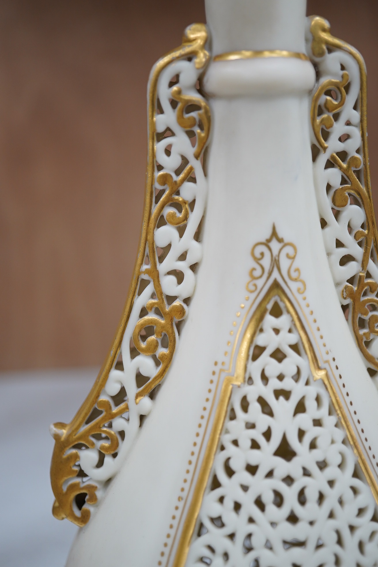 A Grainger's reticulated vase with gilded decoration, 30cm high. Condition - fair to good